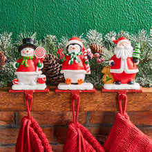 Load image into Gallery viewer, 6.5&quot;H Resin Santa, Snowman, Penguin Stocking Holders, Set of 3
