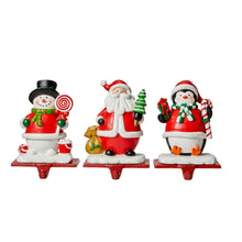 Load image into Gallery viewer, 6.5&quot;H Resin Santa, Snowman, Penguin Stocking Holders, Set of 3
